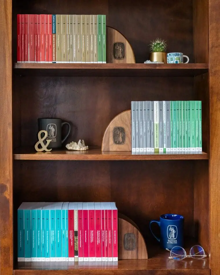 A shelf of Puritan Paperbacks in their color-coded Banner of Truth editions